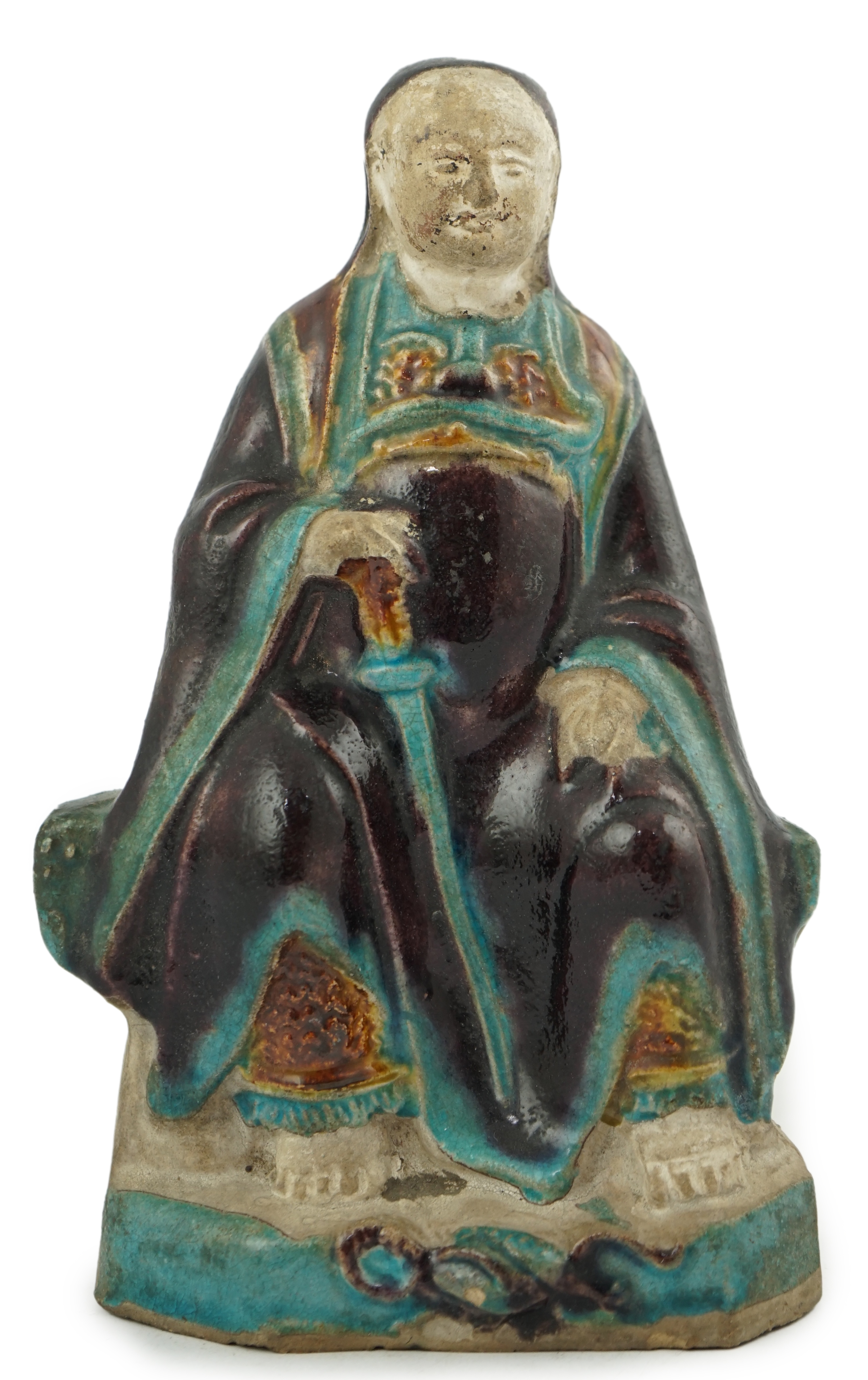 A Chinese fahua seated figure of an official, late Ming dynasty